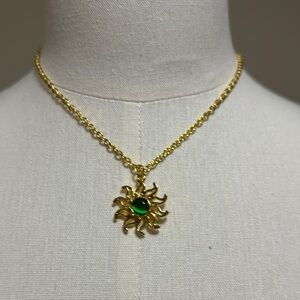 Gold Sun Pendant Necklace with Green Gem